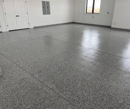 garage floor with gray polyurea/polyaspartic concrete coating